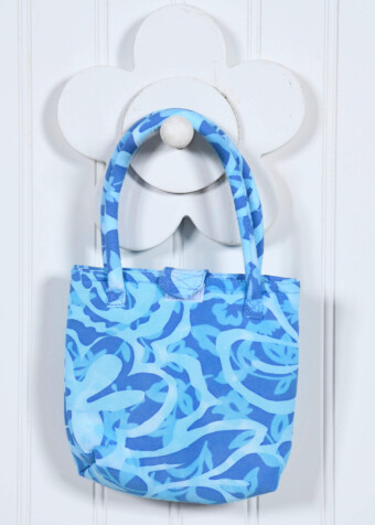 Precious, soft bag created especially for little Blue Ginger girls! The Petite Purse will match her favorite outfits and lets her carry around her own treasures. Coconut button and loop closure. Measures approximately 5" x 6".