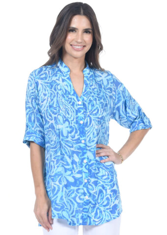 V neck button down blouse with pleats at shoulders to bodice in blue paisley flower print. 